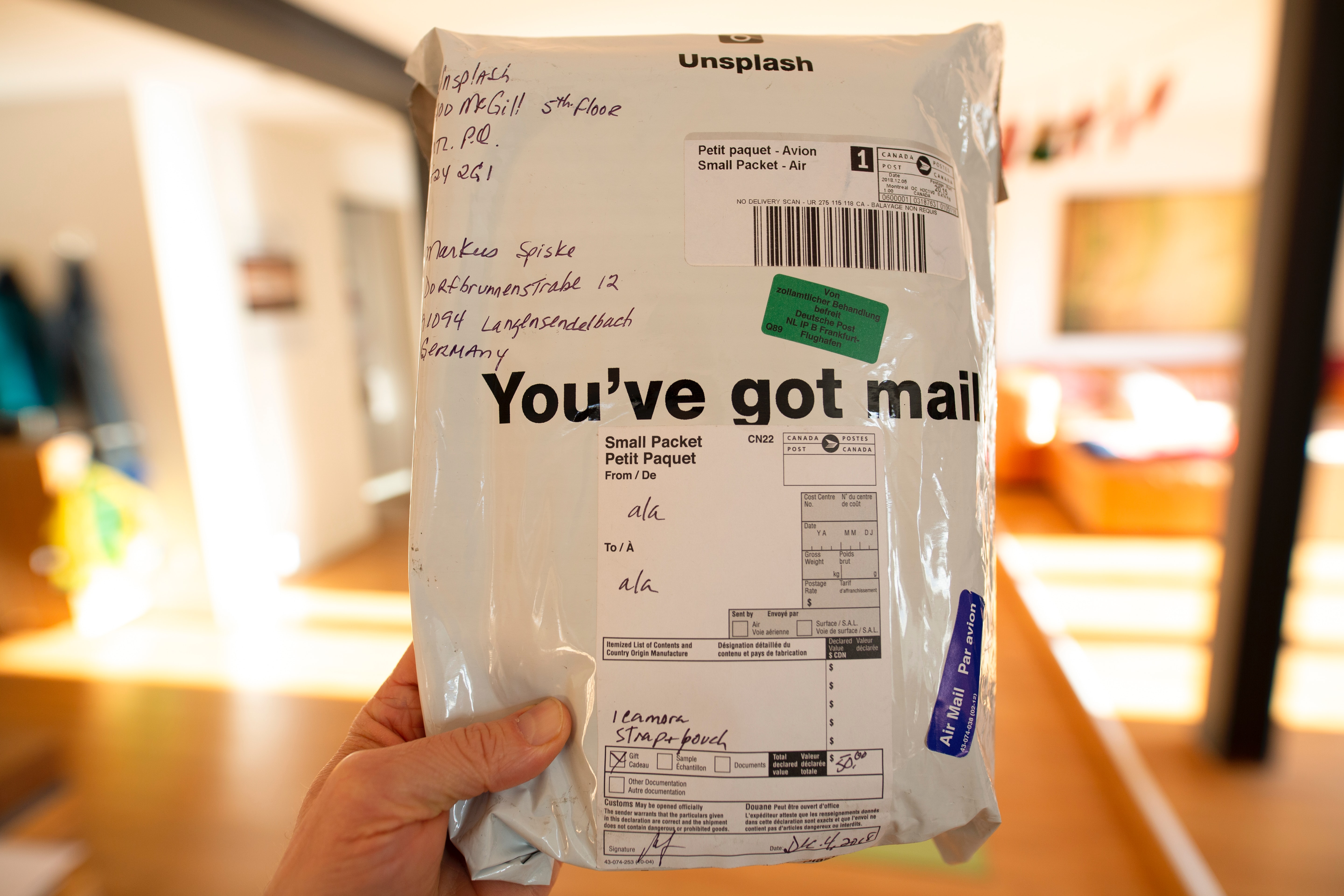 A parcel that has reached the hands of the final recipient: with a clearly visible shipping label.