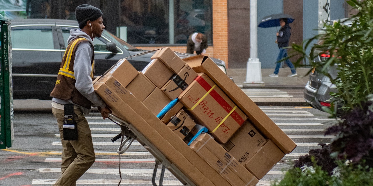 Delivery man in the street, being responsible for lat element of the shipping chain.